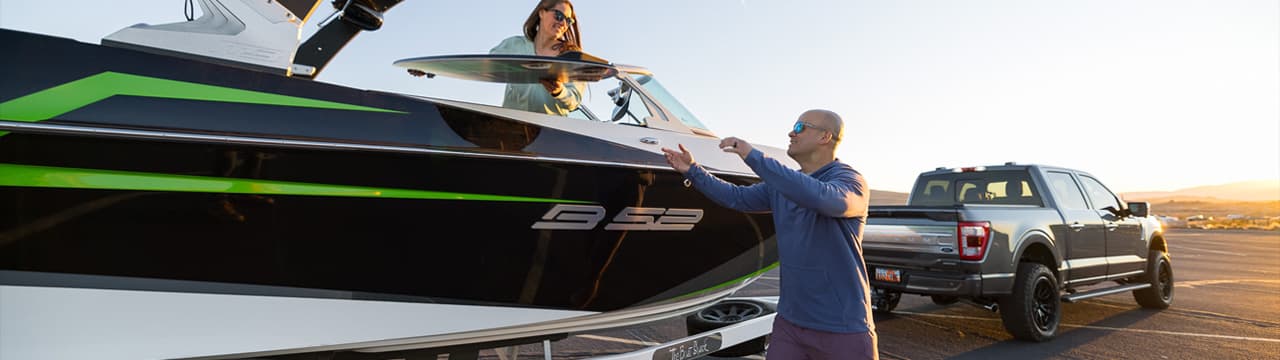 Couple hauling boat.